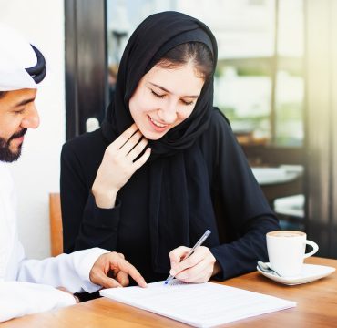 emirati-woman-signing-contract emirati-woman-signing-contract